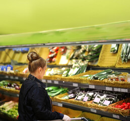 Supermarket shopping,  gloves,woman buying vegetables at the market	