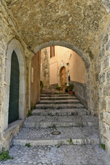 Obraz na płótnie Canvas A narrow street in the old buildings of San Donato Val di Comino, a medieval village in the Lazio region.