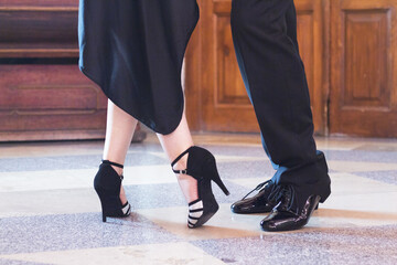 Legs of man and woman dancing Argentine tango