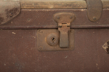 Old brown retro suitcase on a white background