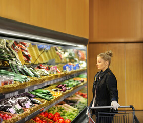Supermarket shopping,  gloves,woman buying vegetables at the market	