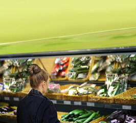 Supermarket shopping,  gloves,woman buying vegetables at the market	
