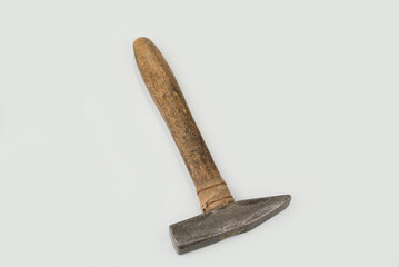 Old used hammer on a white background