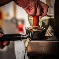Barista  making coffee the professional way