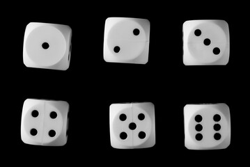 White gambling die, dice for tabletop games and poker set and collection isolated on black background, top view