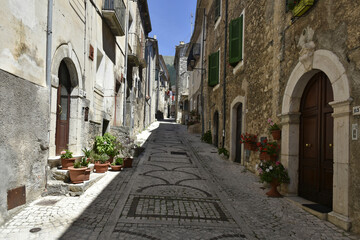 A narrow street in the old buildings of San Donato Val di Comino, a medieval village in the Lazio region.
