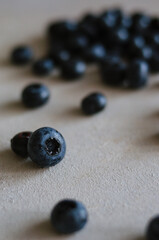 Fresh blueberry on a grey table. Concept for healthy eating and nutrition. Antioxidant organic superfood