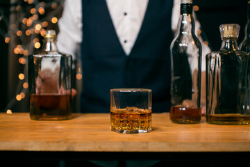 Barman pouring whiskey whiskey glass beautiful night