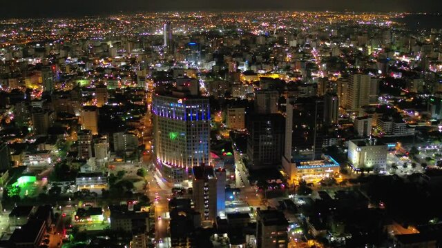 Scenic shot with drone watching the nights in Santo Domingo, an illuminated city