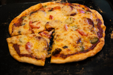 
Pizza with vegetables cooked with cheese