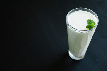 Glass with fresh homemade milk drink (kefit,airan)