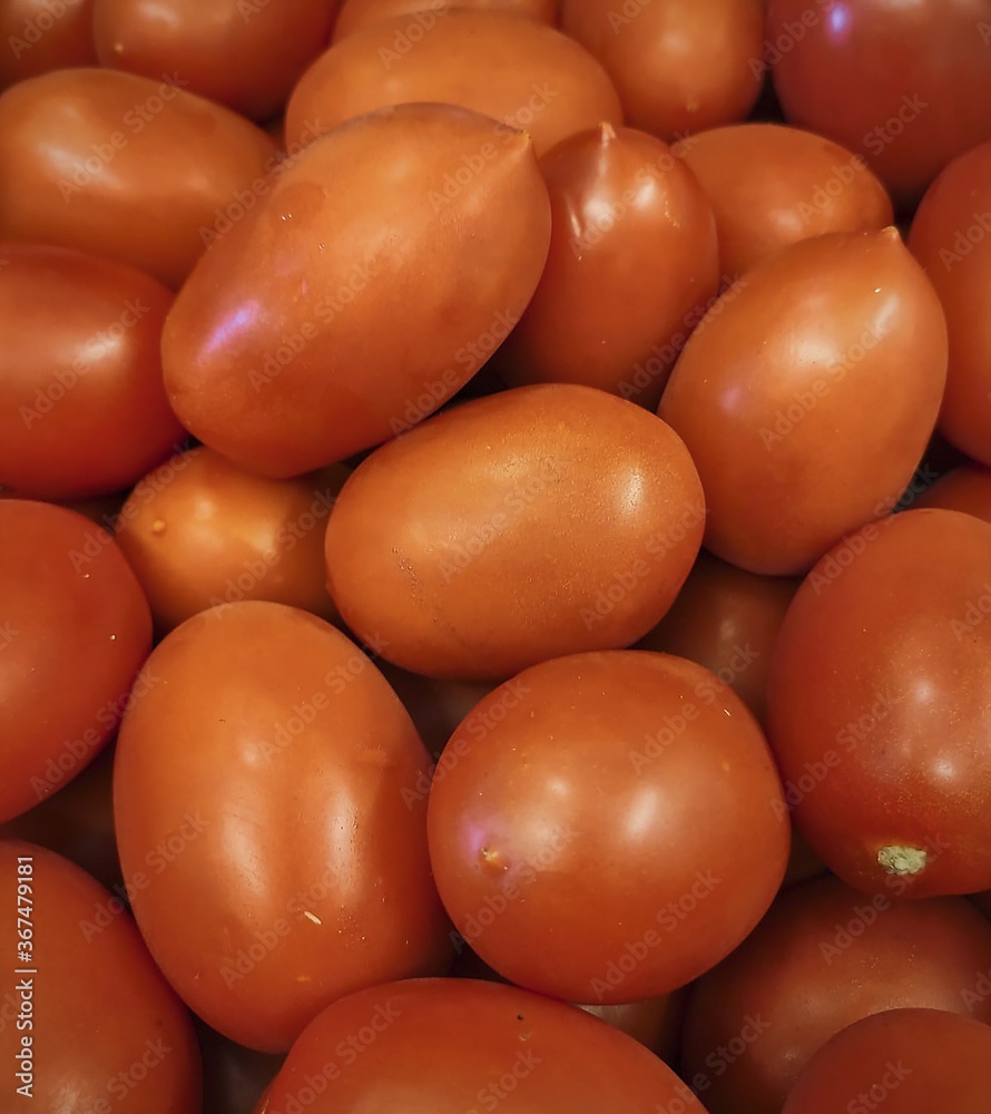 Canvas Prints Closeup shot of fresh tomatoes one n another