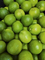 Closeup shot of green limes one on another
