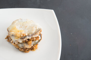 moussaka, eggplant of aubergine. Top view in black background