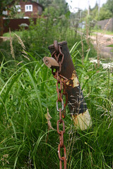 a metal column with a rusty chain and a padlock