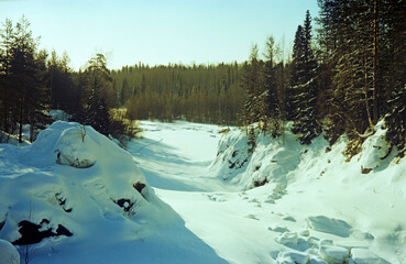 Reserve "Kivach". In winter the waterfall falls asleep. Karelia.