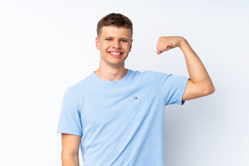 Fototapeta premium Young handsome man over isolated white background doing strong gesture
