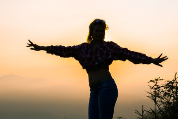 girl tourist high in the mountains