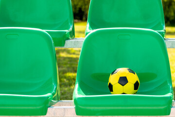 Soccer ball on the green seats
