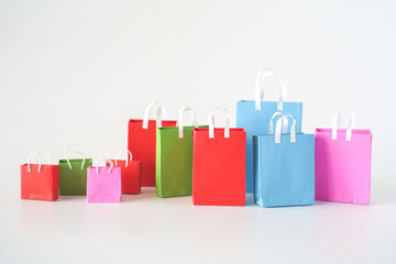 Colorful shopping bags on white background. Shopping service on online web and offers home delivery.  online shopping concept.