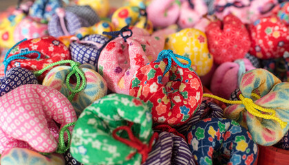 Fototapeta na wymiar 松山市・道後温泉 圓満寺のお結び玉　Colorful wishing balls at Enmanji Temple in Dogo Onsen Town, Matsuyama