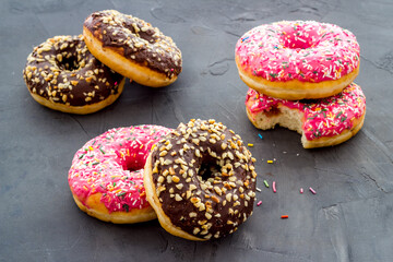 Colorful donuts close up, glazed and sprinkles bakery