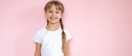t-shirt design concept - smiling little girl in blank white t-shirt pointing at herself
