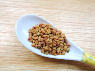 Fenugreek seeds in isolated background.