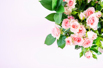 Bouquet of several branches of pink roses. Background of pink roses
