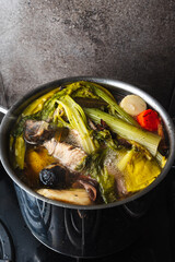 cooking broth on chicken and vegetables