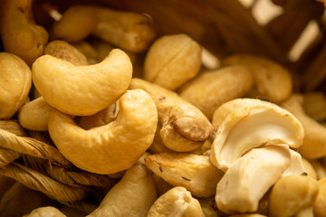 Cashew nuts scattered surface texture. Close up.