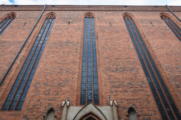 Brick facade of Assumption of the Blessed Virgin Mary in Torun historical city in north central Poland