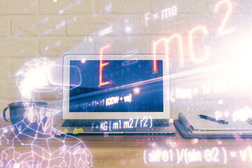 Desktop computer background and formula hologram writing. Double exposure. Education concept.