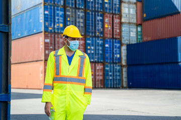 Man worker wearing protective face mask during coronavirus are working at container cargo.,Stop...