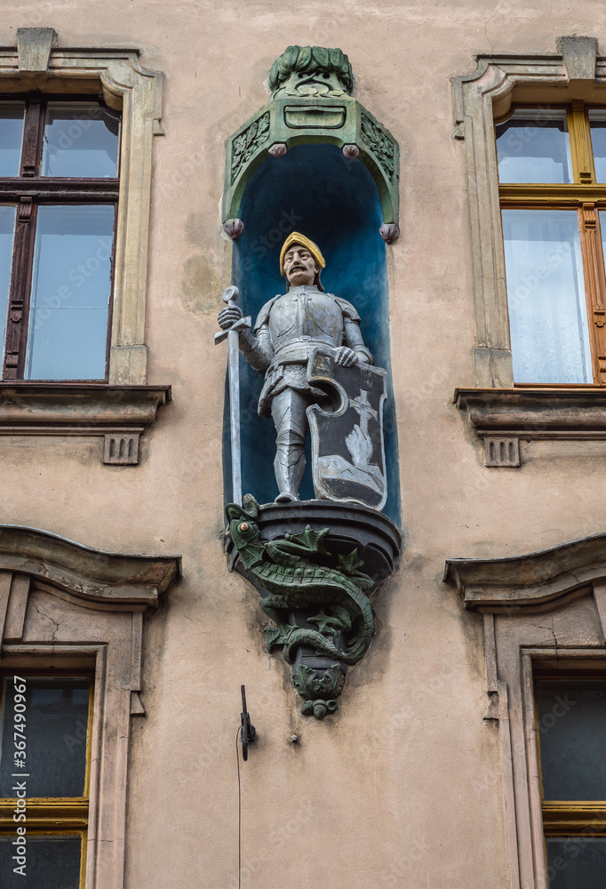 Canvas Prints Statuette of knight on a town house in old part of Torun historic city in north central Poland