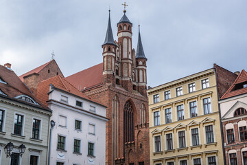 Holy Spirit Church and buildings on the main square of historic part of Torun city in north central Poland