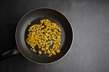 Diet. Organic Grilled Corn in a frying pan. Organic farm vegetables. Vegetarian