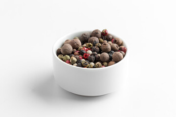 Isolated mixture of different peppers in a bowl