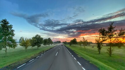 Road in Poland. Sunset. Goldenhour. Beautiful sky.  Landscape in Poland. Lubusz district © Mateusz