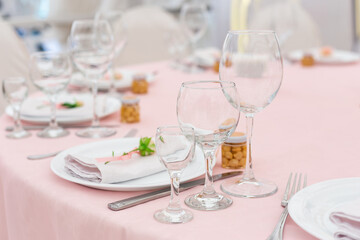 Beautiful decoration set for wedding party. Design by flower, variety luxury glass and candle. Selective focus