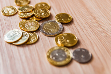coins scattered on a wooden table