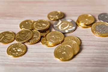 coins scattered on a wooden table