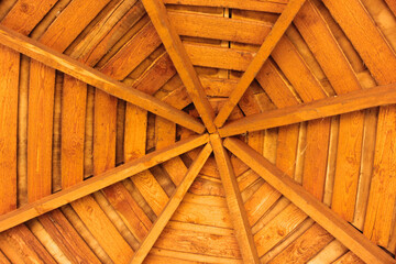 The construction of the wooden roof. Detailed photo of a wooden roof overlap construction.