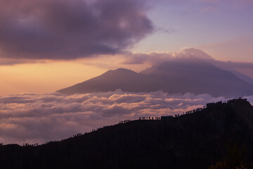 Scenic view of clouds and mist at sunrise