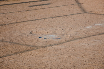 the view of home plate in a baseball diamond in a city park