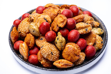 Tasty asian vegetarian appetizer, crunchy rice en peanuts snacks from Japan isolated on white backgound