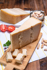 Big wedges of parmigiano-reggiano parmesan hard Italian cheese made from cow milk or Grana Padano