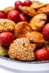 Tasty asian vegetarian appetizer, crunchy rice en peanuts snacks from Japan close up on white backgound