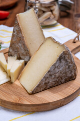 Cheese tomme de montagne or tomme de savoie made from cow milk in French Alps.