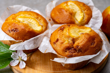 Naklejka na ściany i meble Fresh baked muffins with apple and cinnamon close up